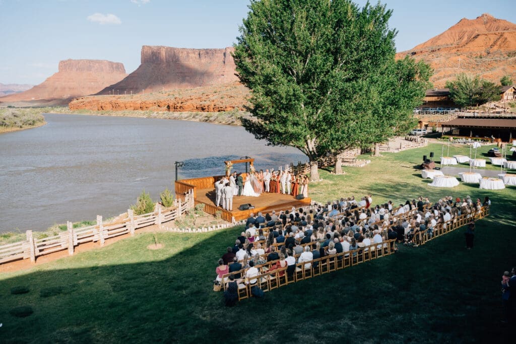 Outdoor wedding ceremony at Red Cliffs Lodge overlooking the Colorado River in Moab, Utah